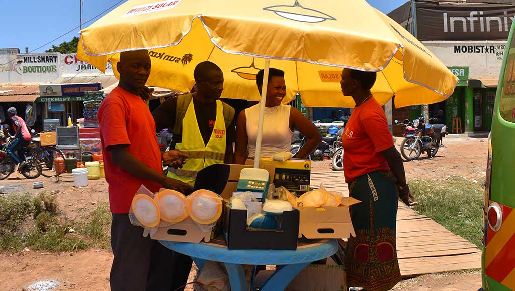 Mwezi pay as you go table at a mini-market on the outskirts of Kisumu