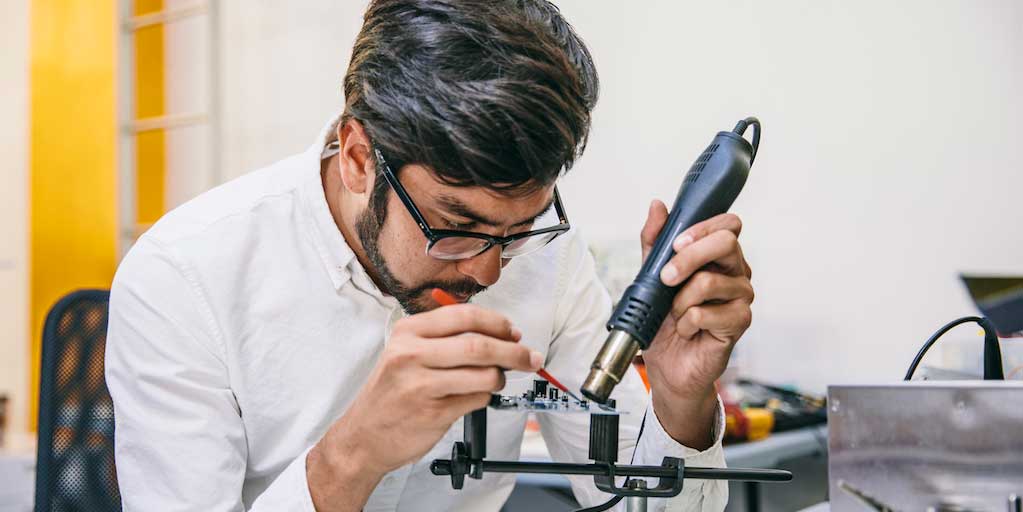 Eric Thorne working on an Angaza development board